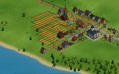 A farm with ploughed fields behind its yard.